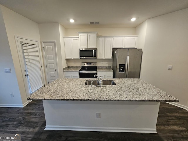 kitchen with white cabinetry, sink, an island with sink, and stainless steel appliances