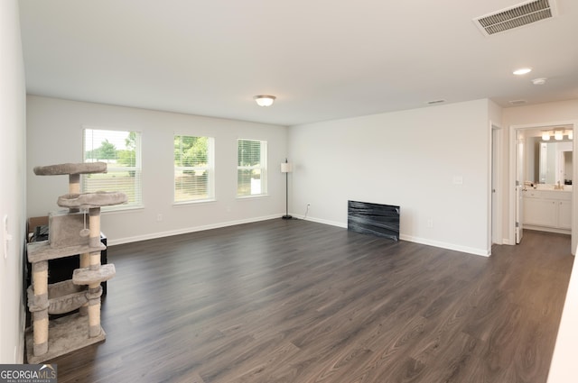 living room featuring dark hardwood / wood-style floors and a fireplace