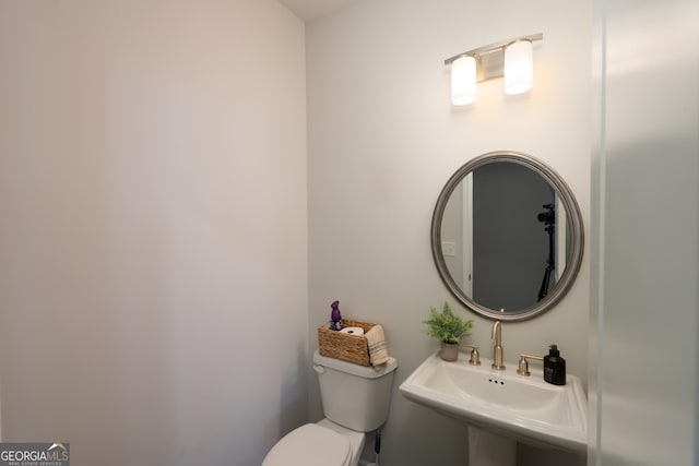 bathroom with toilet and sink