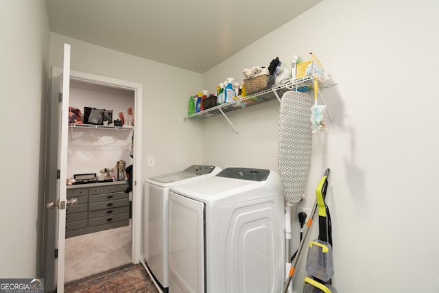 laundry area featuring dark carpet and independent washer and dryer