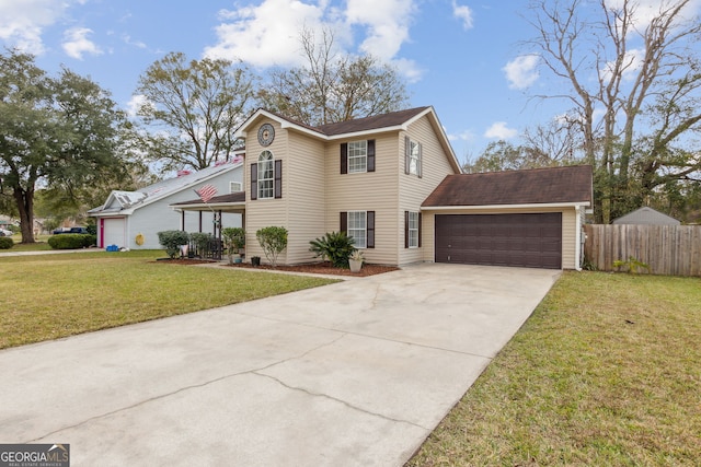 view of property with a garage and a front lawn