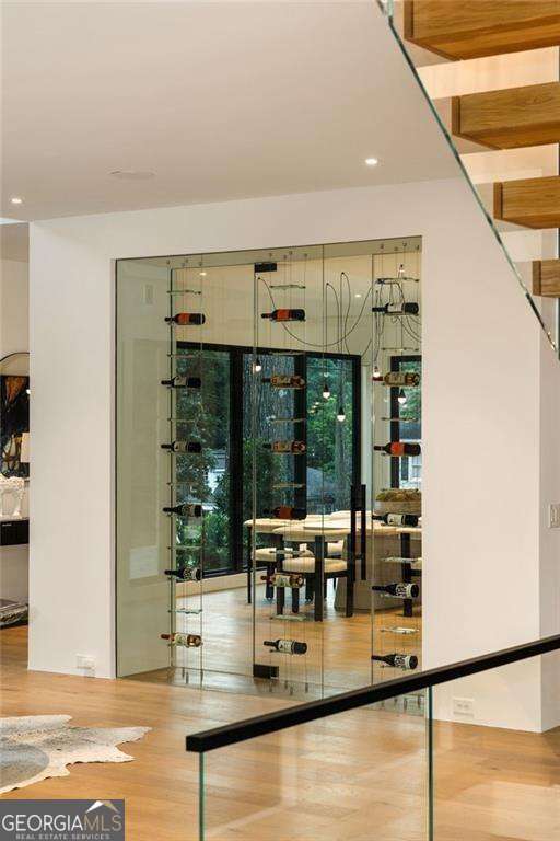 wine area featuring hardwood / wood-style flooring