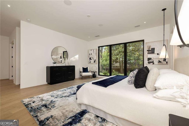 bedroom with light hardwood / wood-style flooring