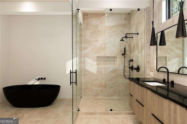 bathroom featuring vanity and an enclosed shower