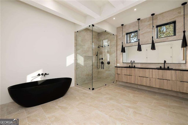 bathroom featuring vanity, beam ceiling, and a shower with shower door