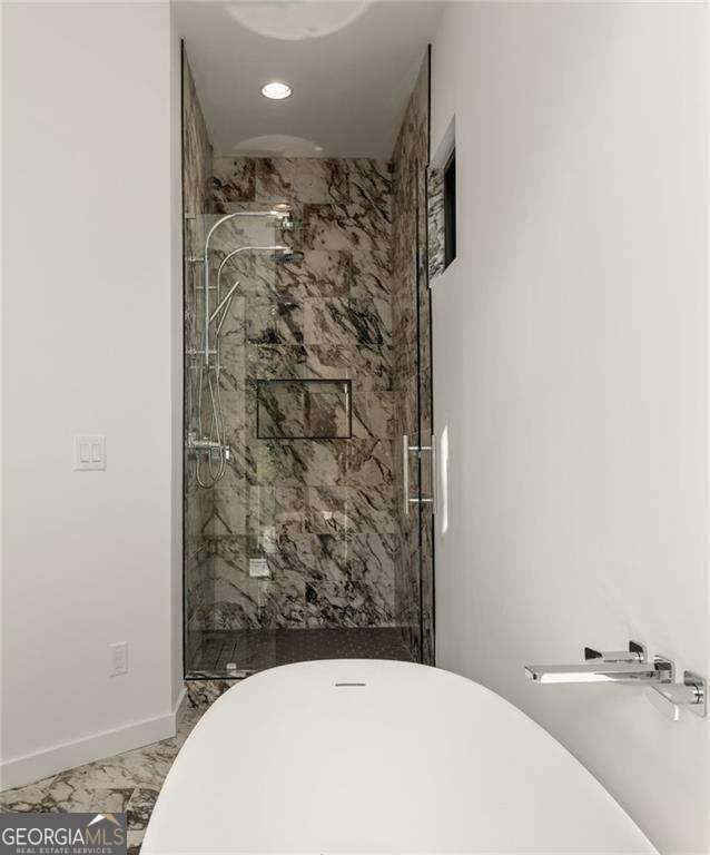 bathroom featuring walk in shower