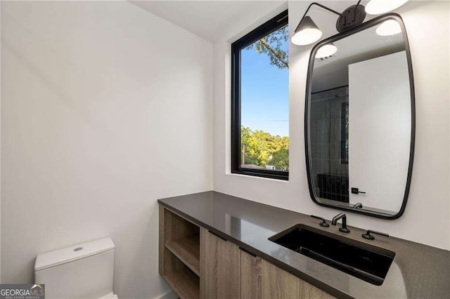 bathroom with vanity and toilet