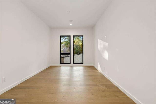 spare room with light wood-type flooring