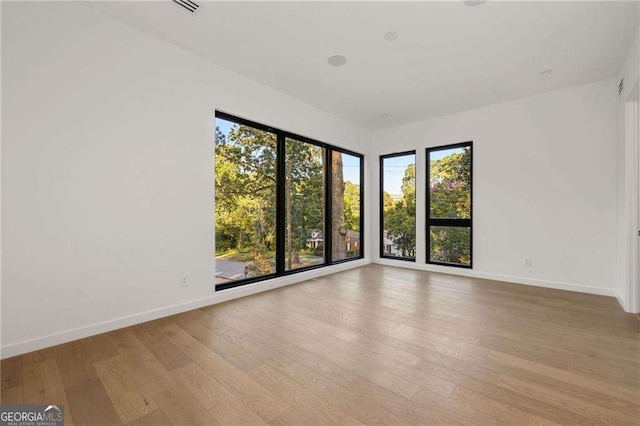 spare room with light wood-type flooring