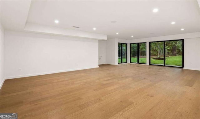 spare room featuring light wood-type flooring