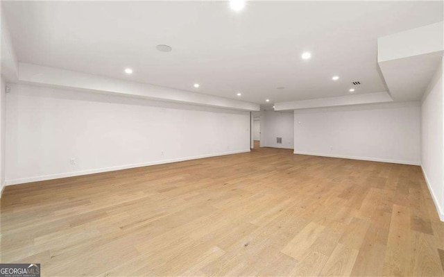 basement featuring light wood-type flooring