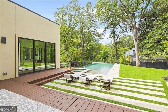 view of pool with a yard and a wooden deck