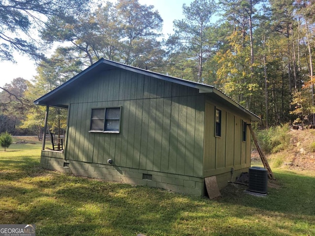 view of property exterior featuring a yard and central AC