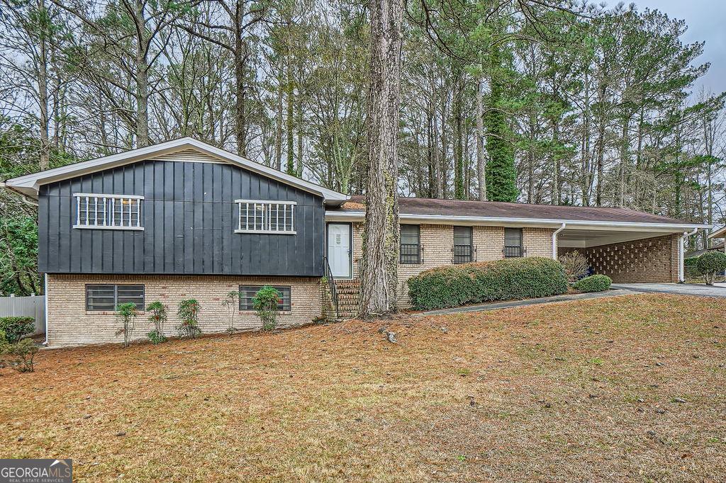 split level home with a carport