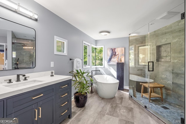 bathroom with shower with separate bathtub and vanity