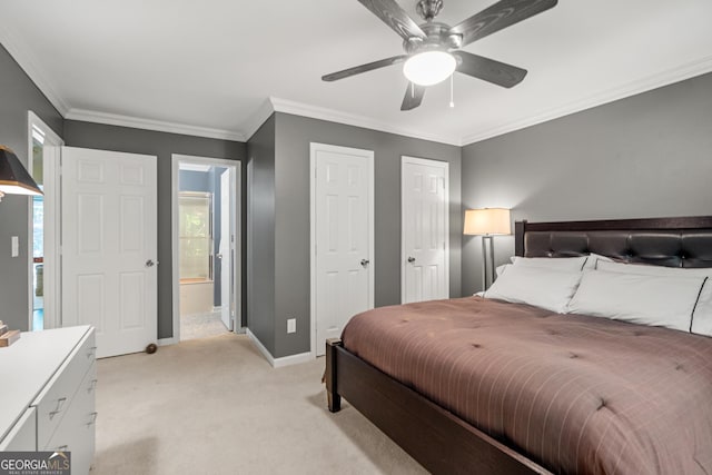 carpeted bedroom with connected bathroom, ceiling fan, and ornamental molding