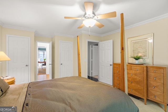 bedroom with ceiling fan, crown molding, and light carpet