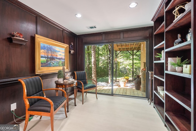 living area with wooden walls