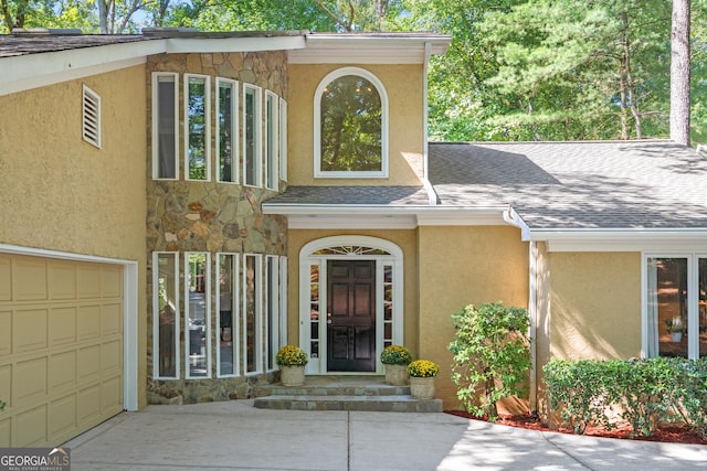 property entrance with a garage