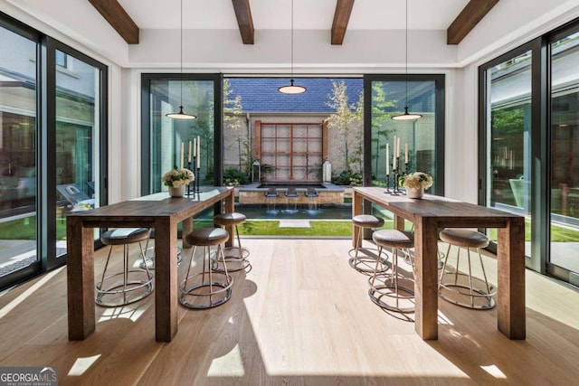 sunroom with beamed ceiling