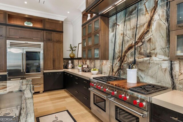 211 N Esplanade, Alpharetta, GA 30009 - kitchen with high quality appliances, backsplash, crown molding, glass insert cabinets, and light wood finished floors