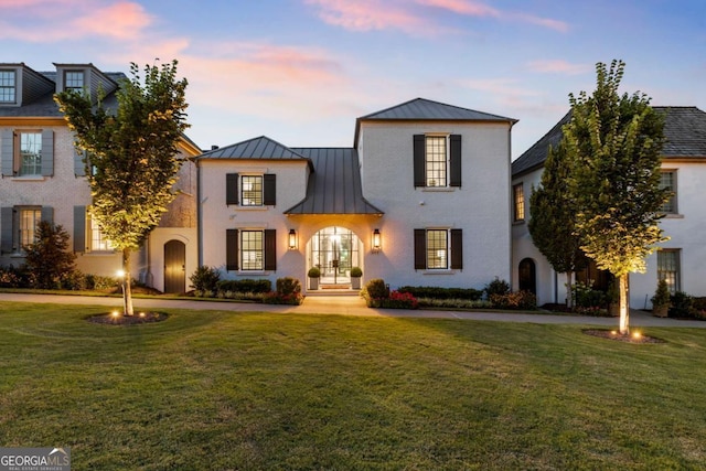 211 N Esplanade, Alpharetta, GA 30009 - view of front of property featuring a standing seam roof, a metal roof, a front yard, and french doors