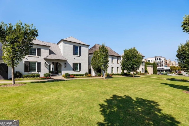 211 N Esplanade, Alpharetta, GA 30009 - view of front of house with a standing seam roof, a front lawn, and a metal roof