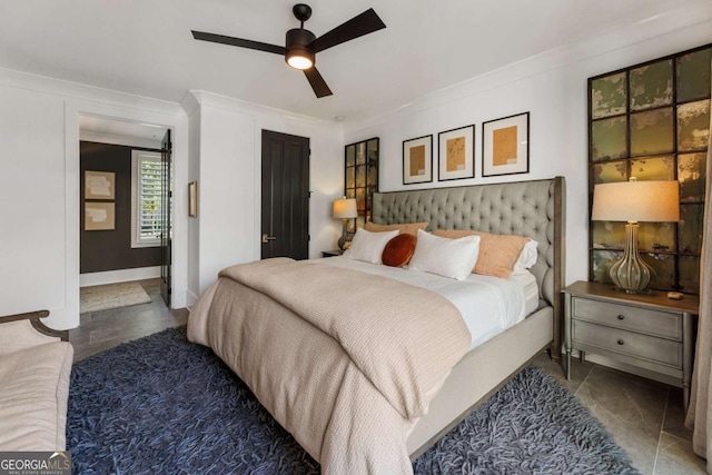 bedroom with ceiling fan and crown molding