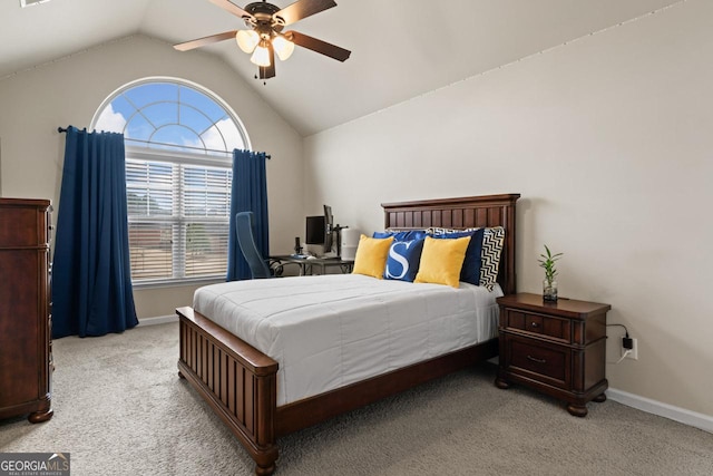 carpeted bedroom with ceiling fan and lofted ceiling