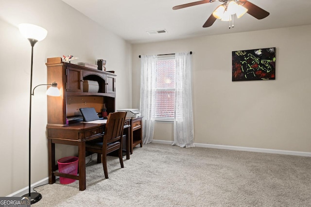 office space featuring ceiling fan and light carpet