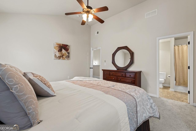 bedroom with carpet flooring, ensuite bathroom, ceiling fan, and lofted ceiling