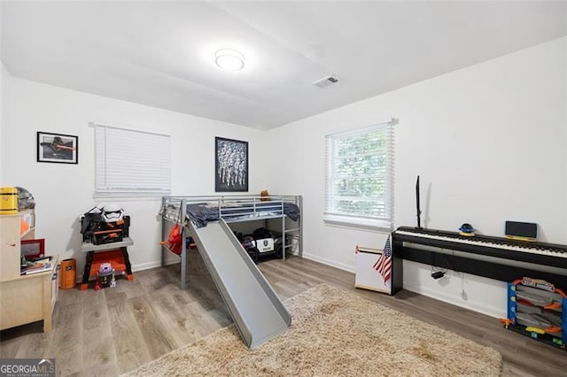 bedroom featuring wood-type flooring