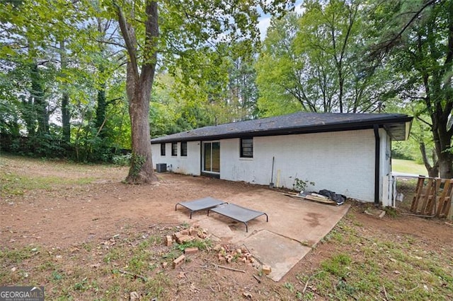 back of property featuring central air condition unit