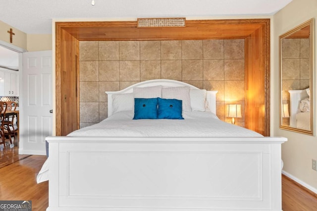 bedroom featuring wood-type flooring