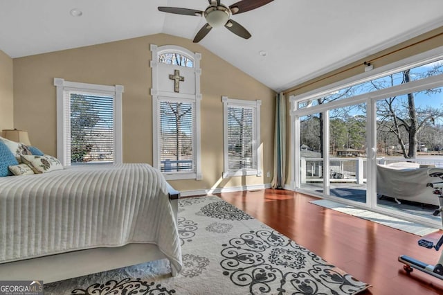 bedroom featuring access to outside, ceiling fan, wood-type flooring, and lofted ceiling