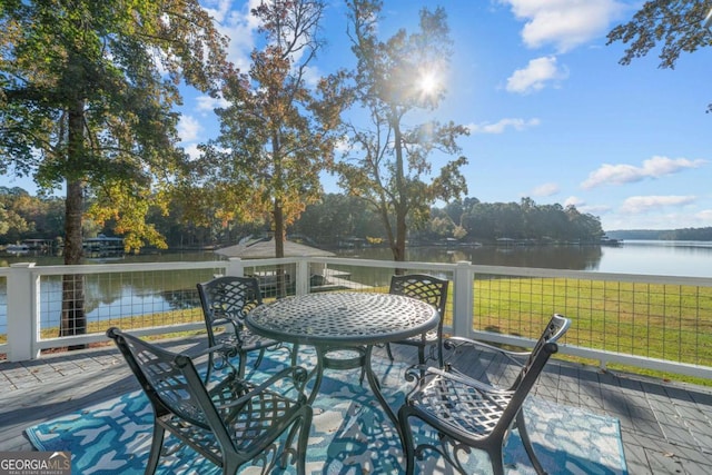 deck featuring a yard and a water view