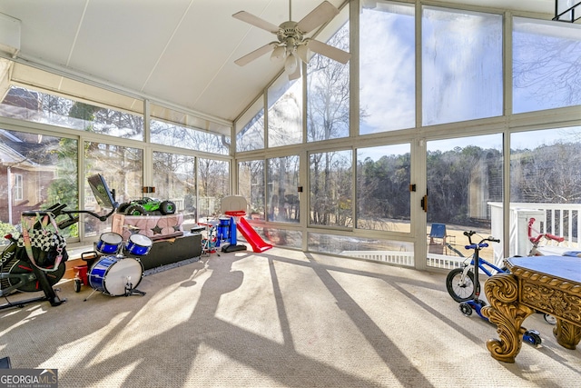 sunroom featuring ceiling fan and lofted ceiling