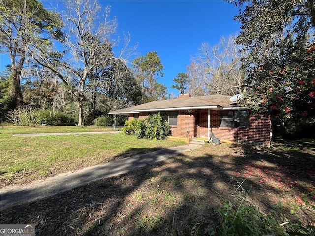 ranch-style house with a front lawn