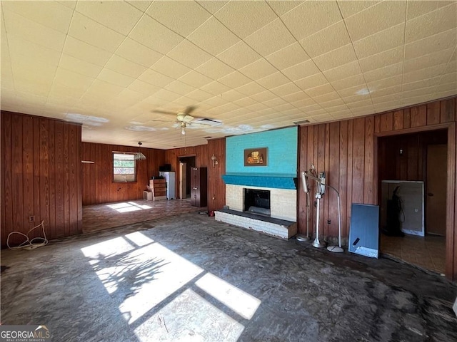 unfurnished living room with ceiling fan