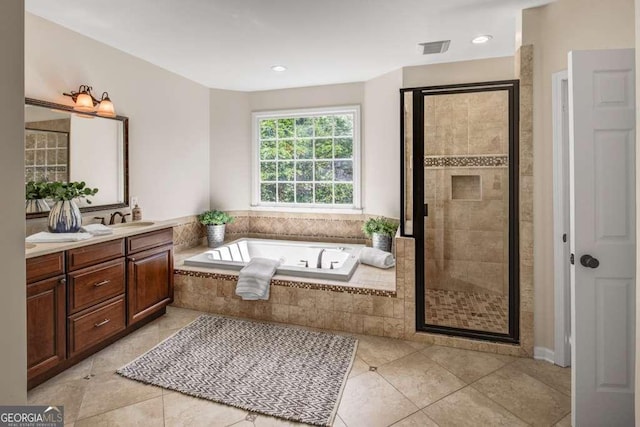 bathroom featuring separate shower and tub, tile patterned flooring, and vanity