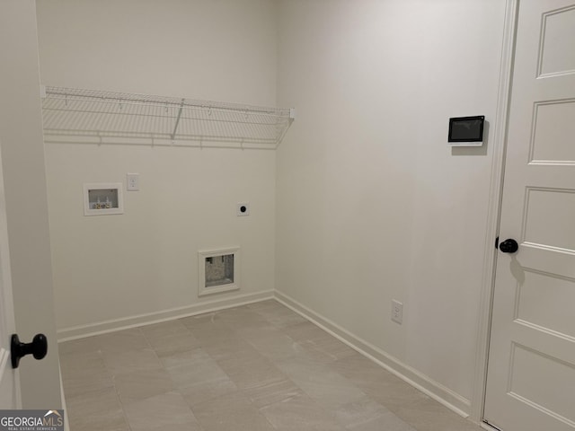 laundry area featuring baseboards, washer hookup, hookup for an electric dryer, and laundry area