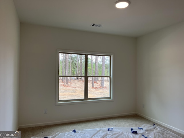 unfurnished room featuring baseboards