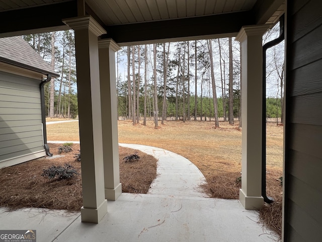 view of yard featuring covered porch