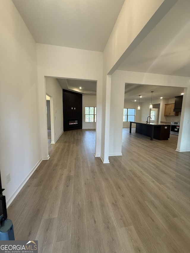 interior space featuring baseboards and wood finished floors