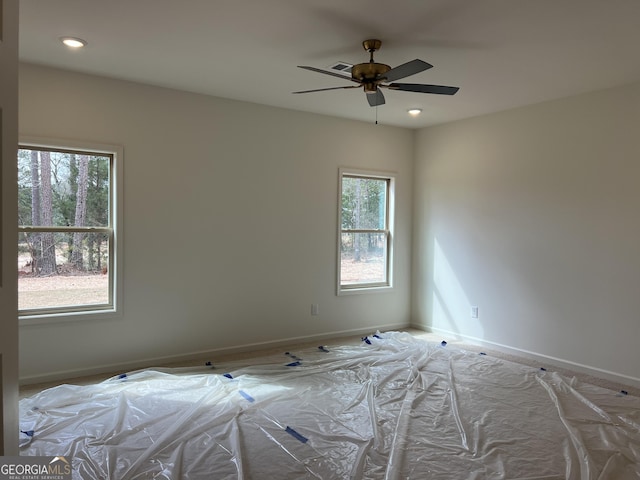 empty room with ceiling fan, recessed lighting, visible vents, and baseboards