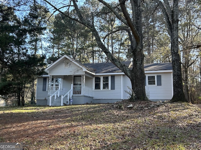 ranch-style home featuring covered porch