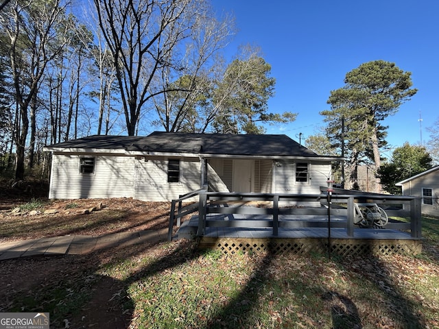 view of front of home featuring a wooden deck