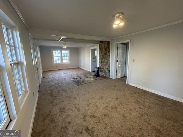 unfurnished room with carpet floors, baseboards, and ornamental molding