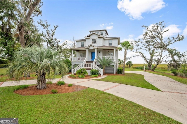 view of front of house with a porch and a front lawn