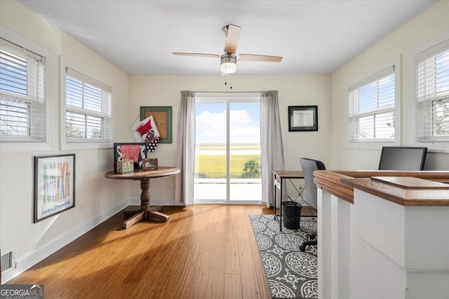 interior space with ceiling fan and light hardwood / wood-style floors